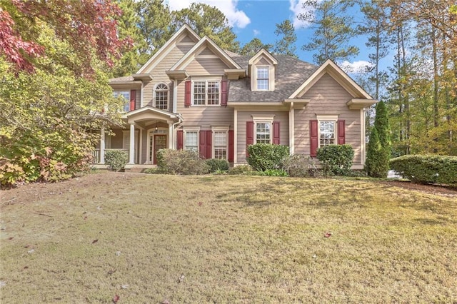 craftsman house featuring a front lawn