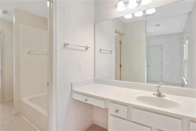 bathroom with tile patterned floors, vanity, and shower / bathtub combination