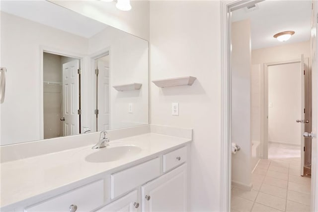 bathroom with tile patterned flooring and vanity