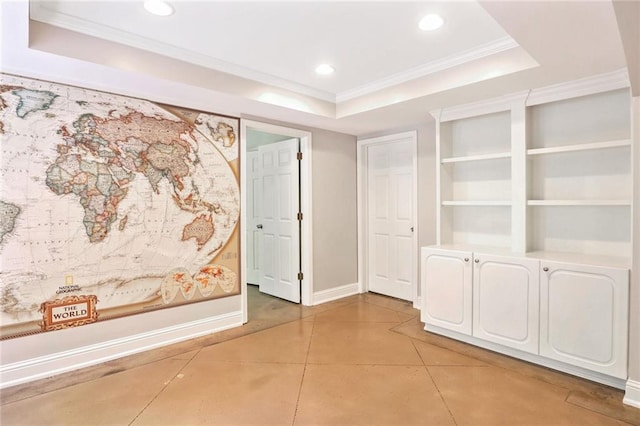 hallway featuring tile patterned floors, crown molding, and a tray ceiling