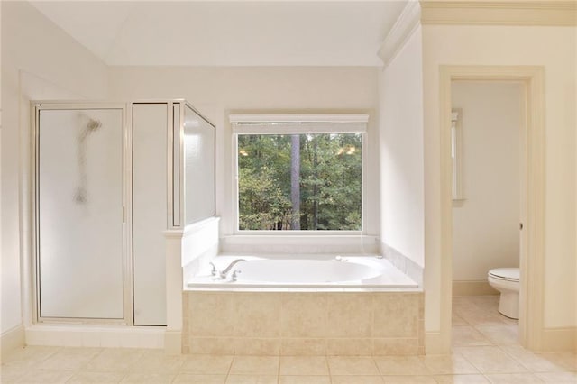 bathroom with tile patterned floors, plus walk in shower, and toilet