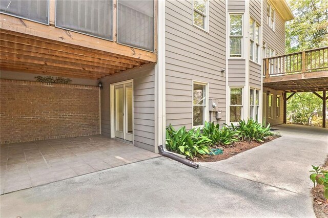 view of home's exterior with a wooden deck