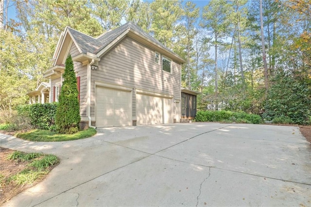 view of side of home featuring a garage