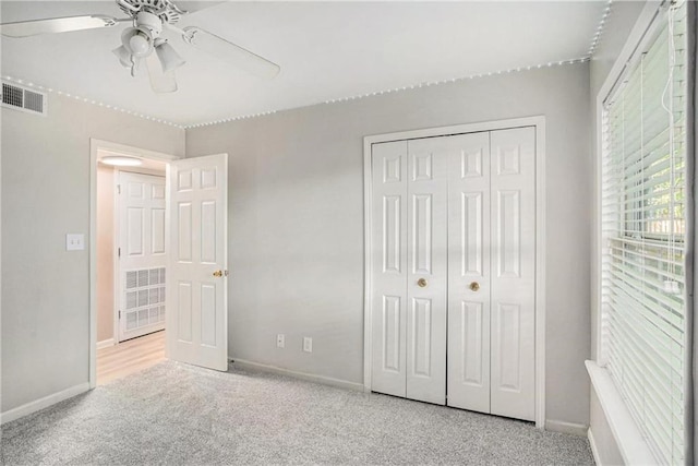 502 Brighton Pt, Atlanta, GA 30328 - unfurnished bedroom featuring carpet, a closet, baseboards, and ceiling fan