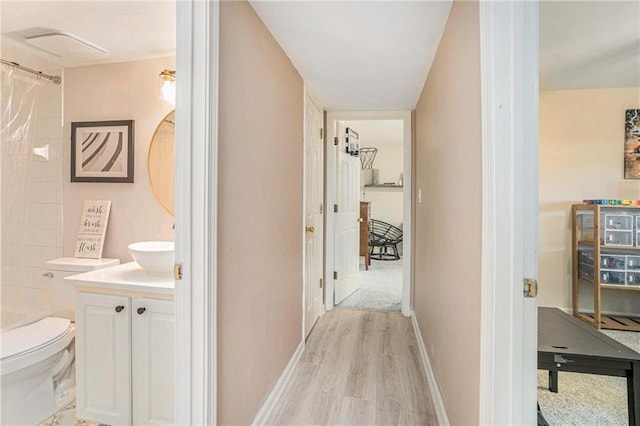 502 Brighton Pt, Atlanta, GA 30328 - hall with light wood-style floors and baseboards