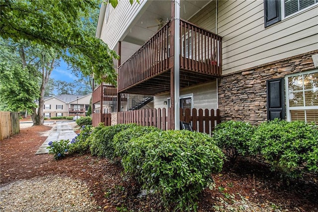 502 Brighton Pt, Atlanta, GA 30328 - view of home's exterior with stone siding and a balcony