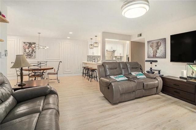 502 Brighton Pt, Atlanta, GA 30328 - living area with light wood finished floors and recessed lighting