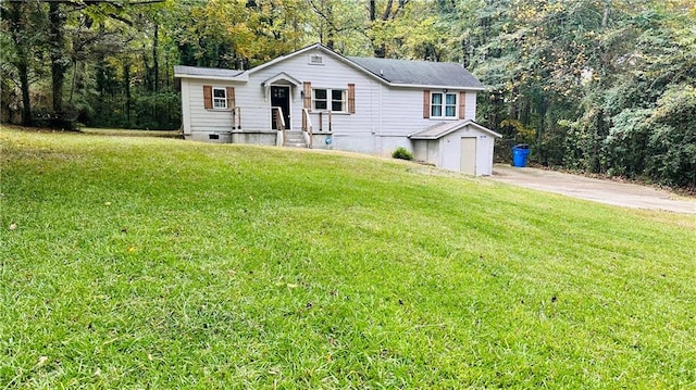 view of front of house with a front yard and a garage