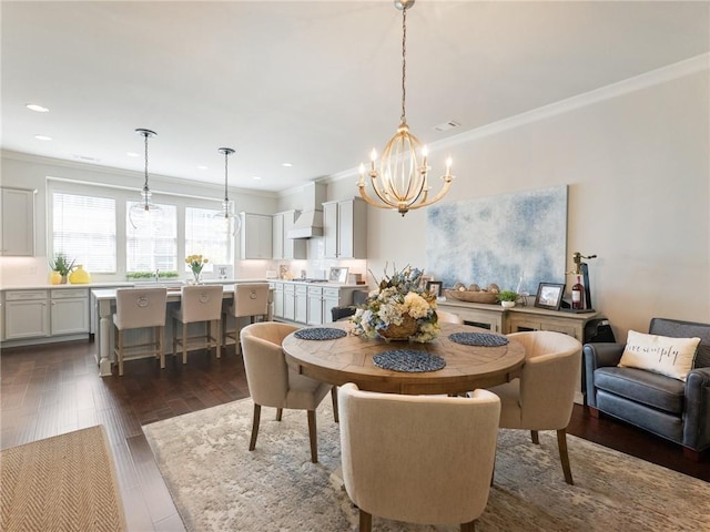 2506 Skyland Dr NE Unit 17, Atlanta, GA 30319 - dining area featuring a chandelier, ornamental molding, dark wood-style flooring, and recessed lighting