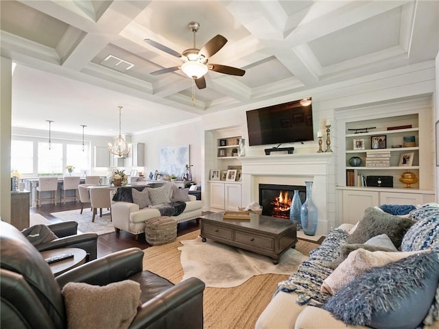 2506 Skyland Dr NE Unit 17, Atlanta, GA 30319 - living room featuring a ceiling fan, a glass covered fireplace, wood finished floors, coffered ceiling, and beamed ceiling
