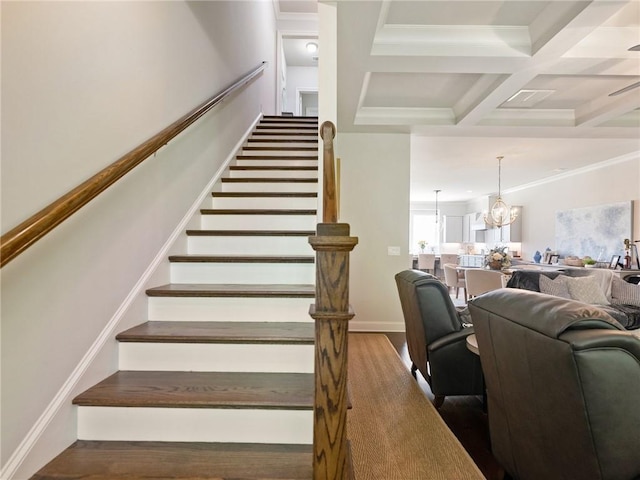2506 Skyland Dr NE Unit 17, Atlanta, GA 30319 - stairway featuring wood finished floors, a chandelier, beam ceiling, coffered ceiling, and crown molding