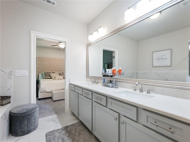 2506 Skyland Dr NE Unit 17, Atlanta, GA 30319 - full bathroom with double vanity, marble finish floors, ensuite bath, and ceiling fan
