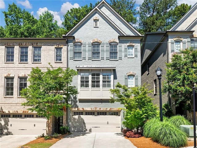 2506 Skyland Dr NE Unit 17, Atlanta, GA 30319 - view of front of home featuring concrete driveway and brick siding