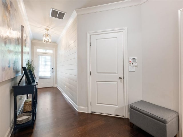 2506 Skyland Dr NE Unit 17, Atlanta, GA 30319 - entryway with ornamental molding, dark wood finished floors, a chandelier, and baseboards