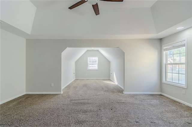 bonus room with vaulted ceiling, carpet, and baseboards