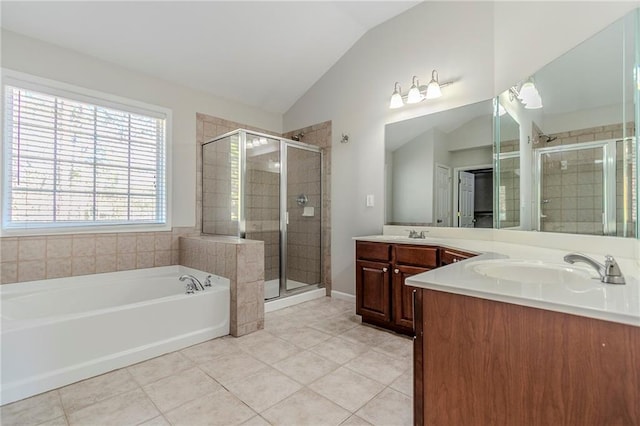 bathroom featuring a garden tub, vaulted ceiling, a shower stall, and tile patterned floors