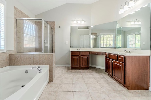 full bath with lofted ceiling, tile patterned flooring, a garden tub, vanity, and a stall shower