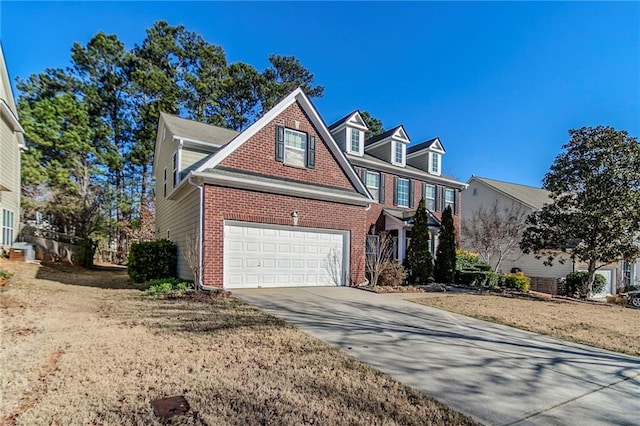 view of front of property featuring concrete driveway and brick siding