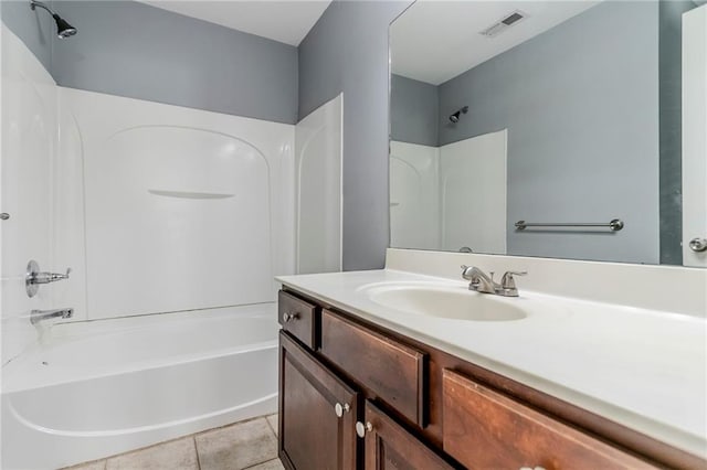 bathroom with tile patterned flooring, visible vents, vanity, and shower / bathtub combination