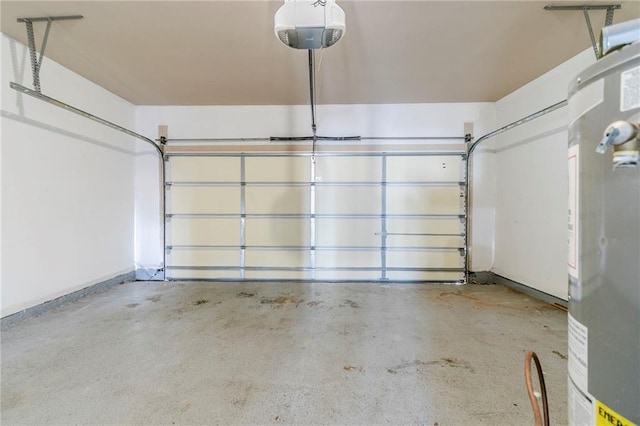 garage featuring gas water heater and a garage door opener