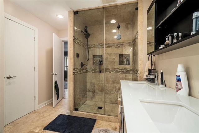 3501 Roswell Rd NE Unit 211, Atlanta, GA 30305 - bathroom with a shower stall, recessed lighting, and double vanity