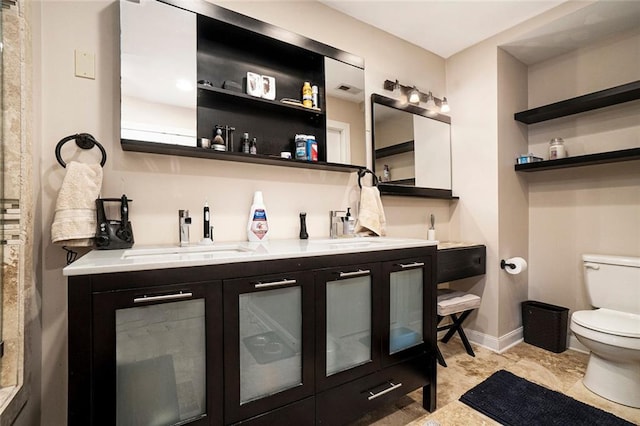 3501 Roswell Rd NE Unit 211, Atlanta, GA 30305 - full bath with toilet, baseboards, and double vanity