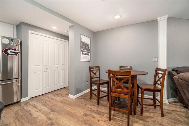 3501 Roswell Rd NE Unit 211, Atlanta, GA 30305 - dining room with wood finished floors, baseboards, and recessed lighting