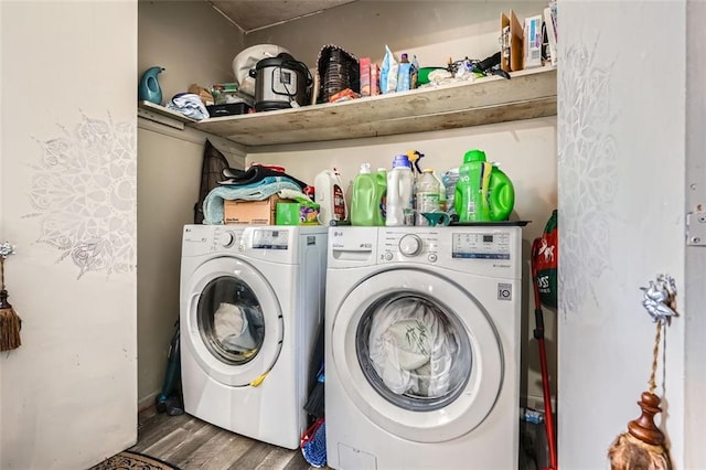 laundry area featuring independent washer and dryer and hardwood / wood-style flooring