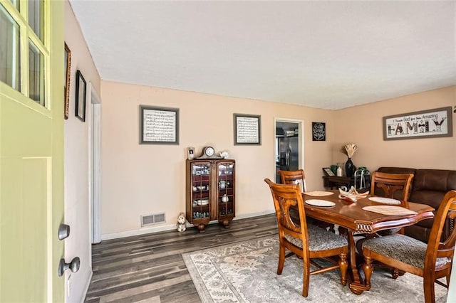 dining room featuring dark hardwood / wood-style floors