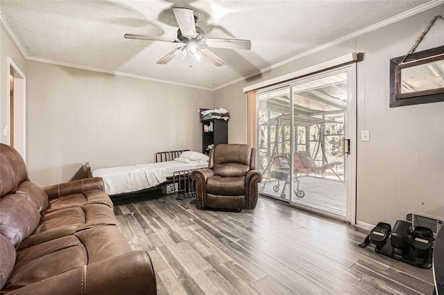 bedroom featuring access to outside, ceiling fan, hardwood / wood-style floors, and ornamental molding