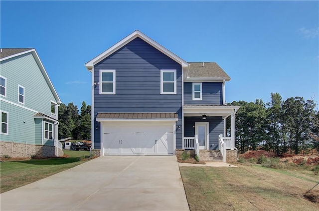 traditional home with a porch, driveway, an attached garage, and a front lawn