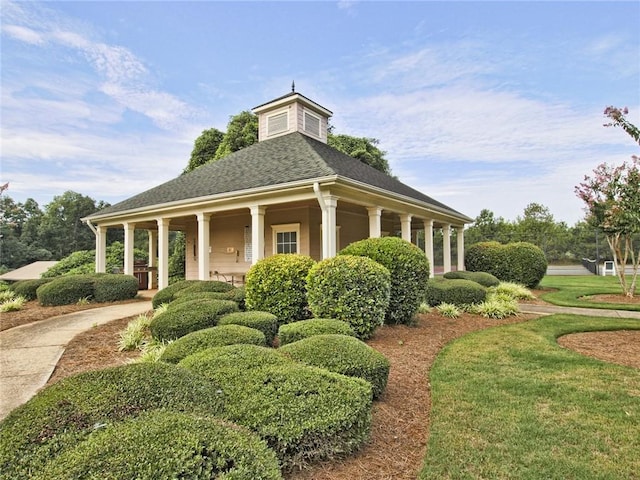 view of property's community with a yard