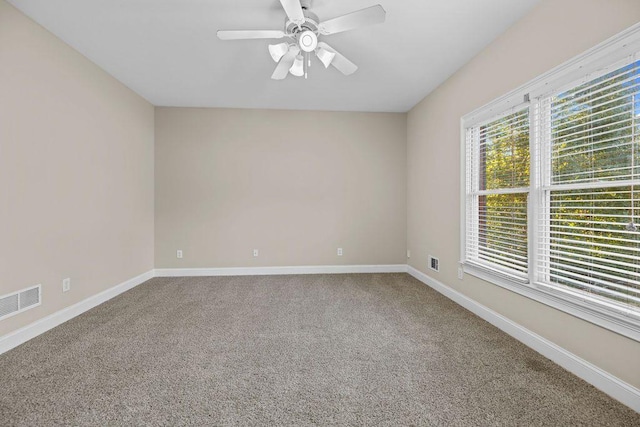 carpeted empty room with ceiling fan