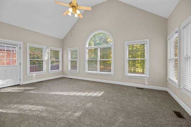 unfurnished sunroom featuring lofted ceiling, plenty of natural light, and ceiling fan