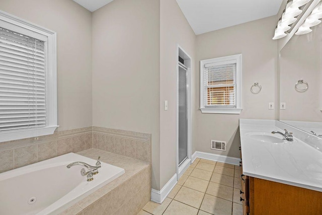 bathroom featuring tile patterned floors, vanity, and independent shower and bath