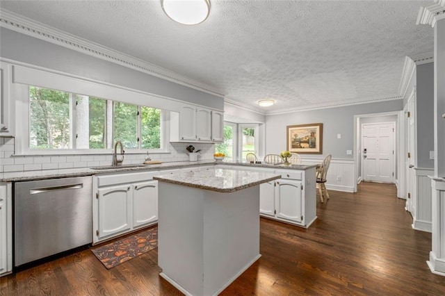 4546 Graywood Trce, Peachtree Corners, GA 30092 - kitchen featuring stainless steel dishwasher, a peninsula, a textured ceiling, white cabinetry, and tasteful backsplash