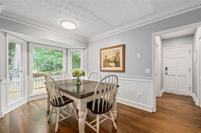 4546 Graywood Trce, Peachtree Corners, GA 30092 - dining space featuring a textured ceiling, ornamental molding, wood finished floors, and a wainscoted wall