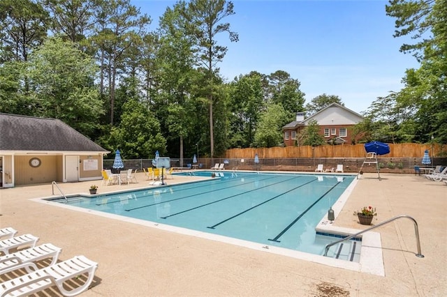 4546 Graywood Trce, Peachtree Corners, GA 30092 - community pool featuring a patio area and view of wooded area
