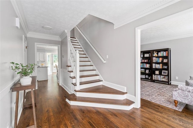 4546 Graywood Trce, Peachtree Corners, GA 30092 - stairway featuring wood finished floors, a textured ceiling, and ornamental molding