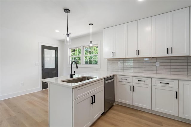 1409 Georgia Ave, East Point, GA 30344 - kitchen featuring dishwasher, white cabinets, backsplash, a peninsula, and recessed lighting