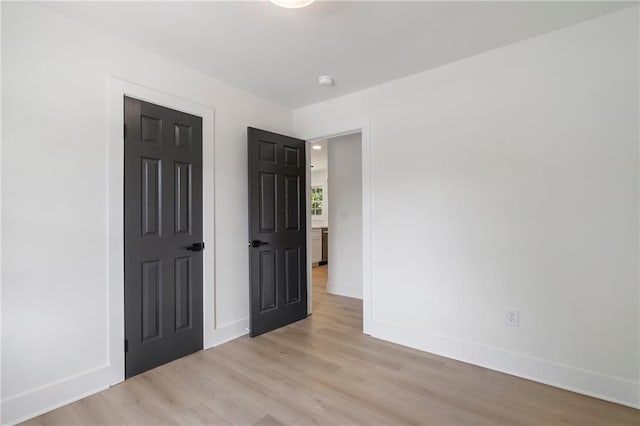 1409 Georgia Ave, East Point, GA 30344 - unfurnished bedroom with light wood-style flooring