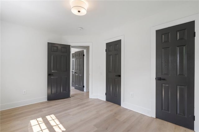 1409 Georgia Ave, East Point, GA 30344 - unfurnished bedroom featuring light wood-style floors