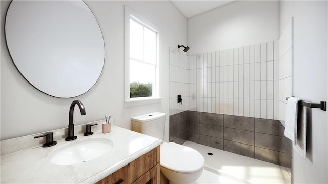 bathroom featuring tiled shower, vanity, and toilet