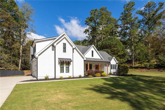 modern farmhouse with a garage and a front yard