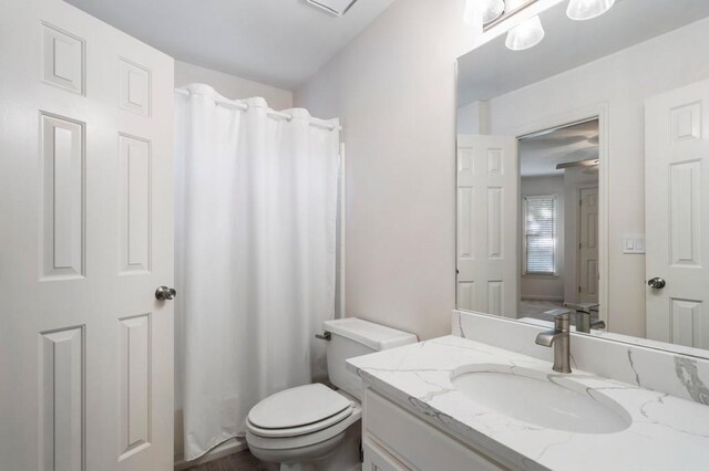 940 Waters Reach Ct, Alpharetta, GA 30022 - bathroom with toilet, a shower with shower curtain, and vanity