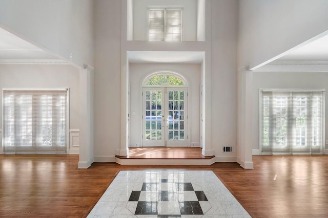 940 Waters Reach Ct, Alpharetta, GA 30022 - entryway with visible vents, a wealth of natural light, wood finished floors, and a towering ceiling