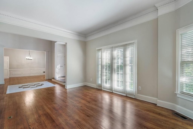 940 Waters Reach Ct, Alpharetta, GA 30022 - unfurnished room with an inviting chandelier, wood finished floors, a healthy amount of sunlight, and visible vents