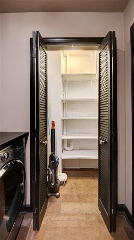 470 Ansley Walk Ter NE, Atlanta, GA 30309 - laundry area with washer / clothes dryer and light wood-type flooring