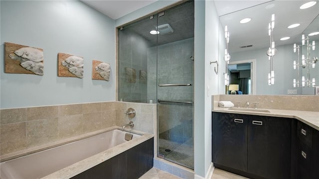 470 Ansley Walk Ter NE, Atlanta, GA 30309 - bathroom with vanity, a bath, a shower stall, recessed lighting, and tile patterned flooring