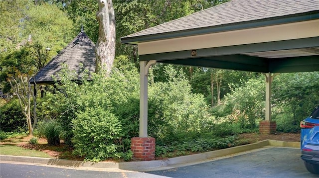 470 Ansley Walk Ter NE, Atlanta, GA 30309 - view of vehicle parking with a forest view